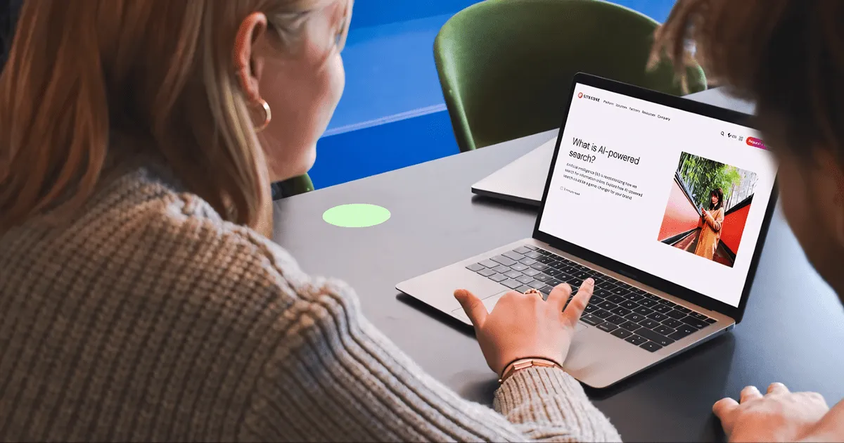 Woman using a laptop on the Sitecore Search page